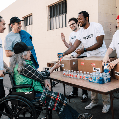 Volunteers wearing custom t-shirts at a community event table