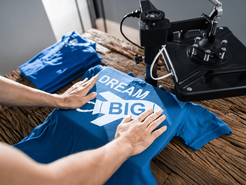 Two people wearing premium custom T-shirts showcasing front and back logo printing for professional brand apparel.